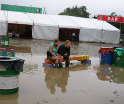 Sitting in the mud at Glasto 2005